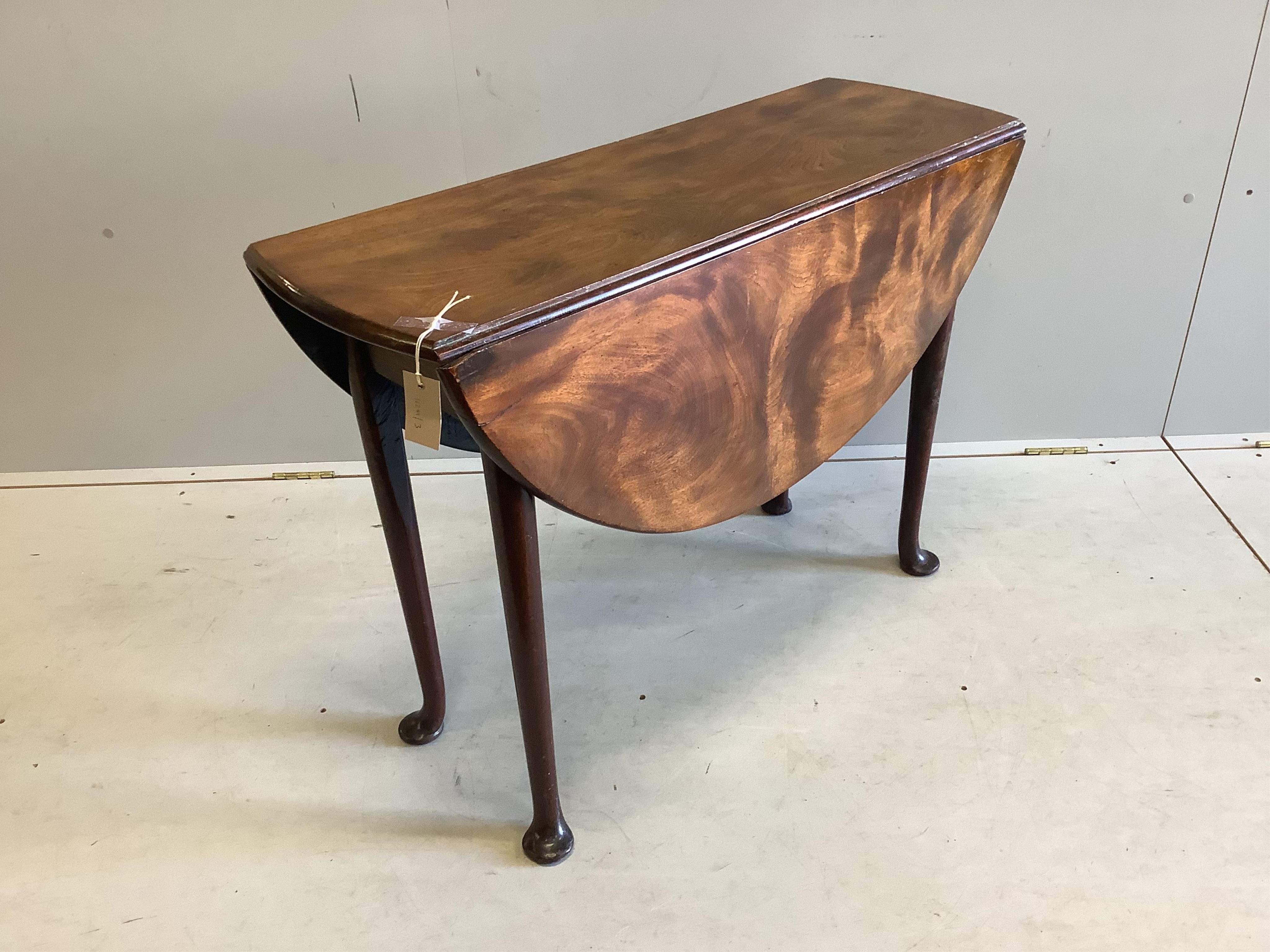 A small George III mahogany drop leaf pad foot table, width 103cm extended, depth 94cm, height 69cm. Condition - fair to good